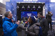 Ecolab CEO Christophe Beck, left, celebrated on Sunday, March 12, as the snow came down with employee Tina Grant, and her husband Rick Grant, during a