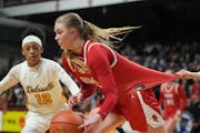 A defender weighed in from behind when Benilde-St. Margaret’s Olivia Olson drove against DeLaSalle and Aneisha Scott on Wednesday.