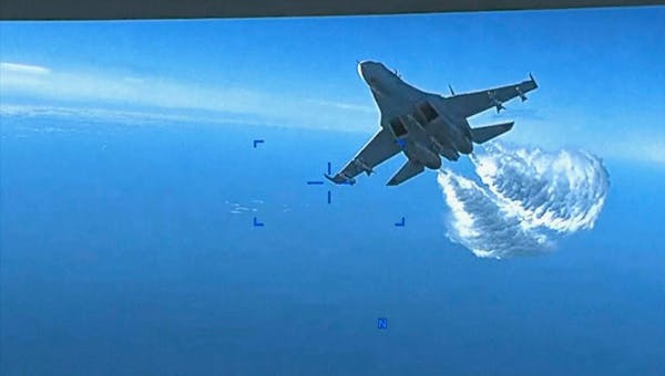 U.S. military video shows Russian jet dumping fuel on drone