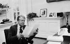 A photo taken in 1978 shows U.S. President Jimmy Carter phoning at his desk at the White House in Washington, D.C.