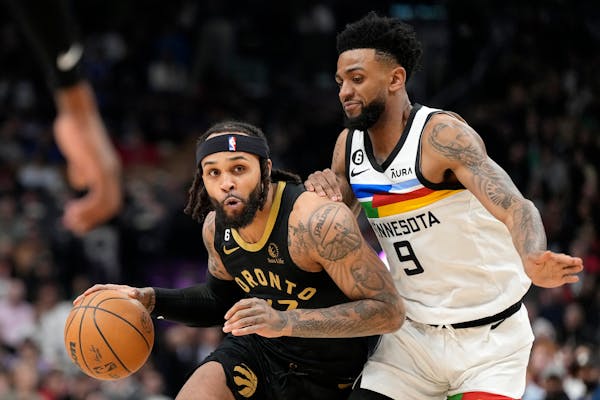 Timberwolves guard Nickeil Alexander-Walker defended against Raptors guard Gary Trent Jr. during the first half Saturday