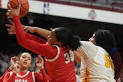 Kendall McGee (30) of Benilde-St. Margaret’s competed for a loose ball with Jordyn Johnson of DeLaSalle during the quarterfinals.