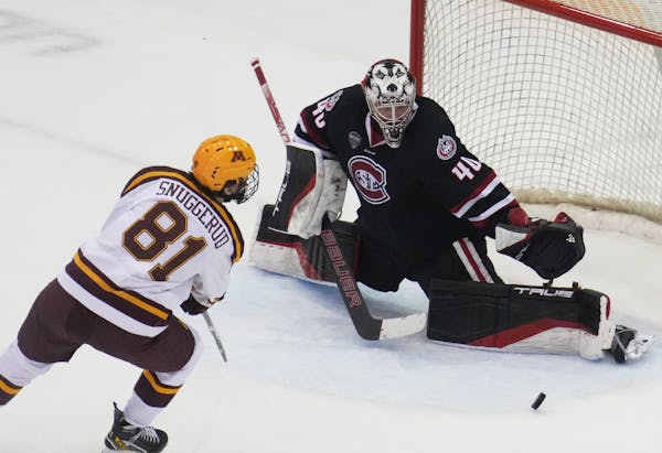 The Gophers’ Jimmy Snuggerud shot against St. Cloud State goalie Jaxon Castor in a January game. The Gophers and Huskies might be assigned to the NC