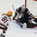 The Gophers’ Jimmy Snuggerud shot against St. Cloud State goalie Jaxon Castor in a January game. The Gophers and Huskies might be assigned to the NC