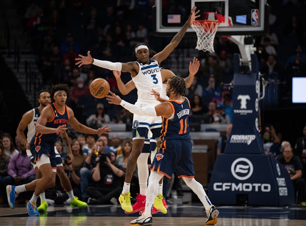 Wolves forward Jaden McDaniels (3) defended a pass by Knicks guard Jalen Brunson (11) during New York’s 120-107 victory on Nov. 7, 2022 at Target Ce