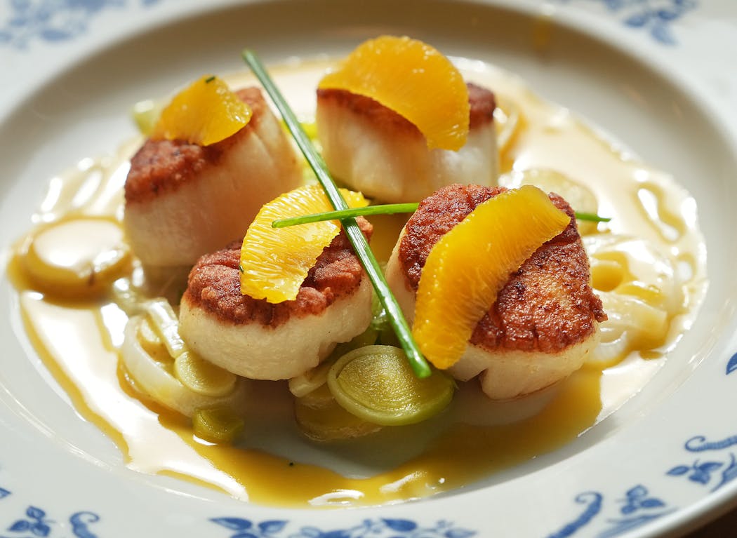 The scallops with orange sauce and leeks, served with fingerling potatoes, is worth a return visit to Chloe in downtown Minneapolis.