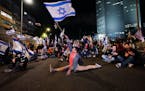 Demonstrators block a highway during protest against plans by Prime Minister Benjamin Netanyahu’s government to overhaul the Israel’s judicial sys