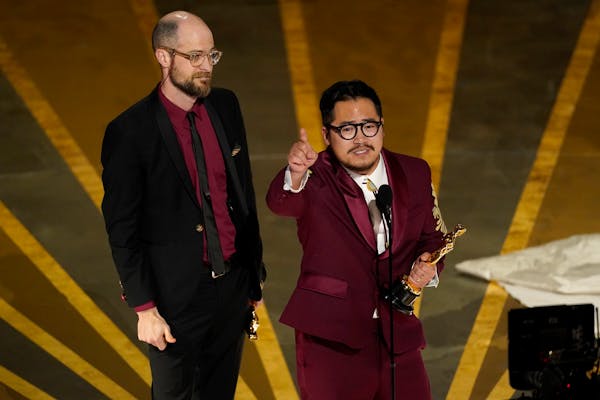 Daniel Scheinert and Daniel Kwan accepted the award for best original screenplay for “Everything Everywhere All at Once.”