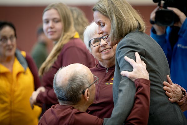 Dawn Plitzuweit greeted her family after Monday’s introductory news conference as Gophers women’s basketball coach.