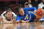 St. Michael-Albertville’s Tessa Johnson, right, and Hopkins’ Kelly Boyle competed for a loose ball Saturday.