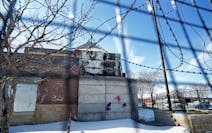 The former Minneapolis police Third Precinct building still stands in its burnt-out state at Lake Street and Minnehaha Avenue. The city is gathering f