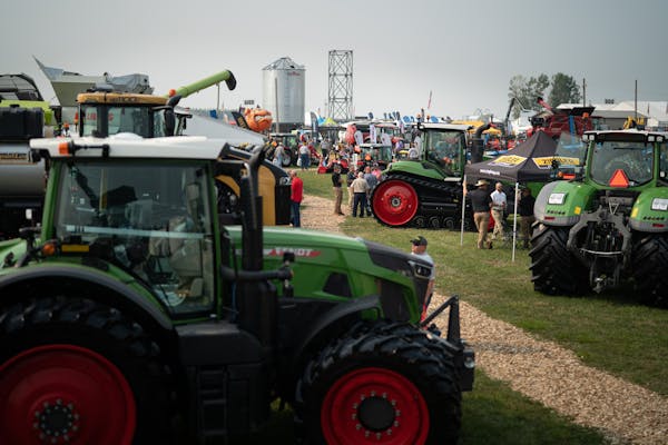 Folks gathered to talk and get a look at the equipment offerings at Ziegler Ag Equipment, Farmfest 2021. 