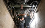 Russ Isbrandt, a shop volunteer, checks the oil levels on motor suspension bearings of a 1908 streetcar Tuesday, March 21, 2023 in the George Isaacs C