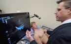 Thomas Pahl, PA-C, Director of Point of Care Ultrasound at Glacial Ridge Health Systems, demonstrates the capability of the point of care ultrasound e