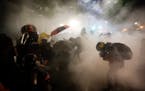 Federal officers launched tear gas at demonstrators during a Black Lives Matter protest at the Mark O. Hatfield United States Courthouse in Portland, 