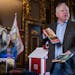 Gov. Tim Walz discussed some of the books banned elsewhere that are going into the Little Free Library outside his office at the State Capitol.
