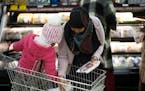 Fadumo Farah shopped for meat at Holy Land with her 5-year-old daughter Samiya, who was on spring break, in preparation for the first evening of Ramad