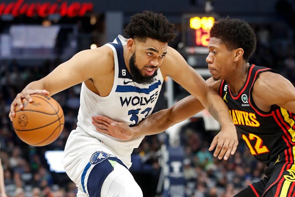 Timberwolves center Karl-Anthony Towns, playing in his first game since November, worked past Hawks forward De’Andre Hunter in the first quarter Wed