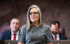 FILE - Democratic Arizona Gov. Katie Hobbs, center, delivers her state of the state address at the Arizona Capitol in Phoenix on Jan. 9, 2023. The Ari