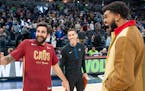 Karl-Anthony Towns greeted former teammate Ricky Rubio when the Timberwolves played Cleveland while Towns was sidelined. Wolves assistant Pablo Prigio