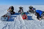 Riding identical Arctic Cat snowmobiles and pulling sleds filled with extra parts, food and other gear, Paul Dick, Rex Hibbert and Rob Hallstrom — �