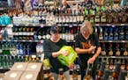 Shoppers browsed products at Lakeville Liquors in 2021.