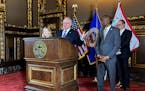 Gov. Tim Walz and Democratic legislative leaders announce a spending agreement at the State Capitol on Tuesday.