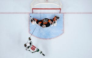 The Wild’s Frederick Gaudreau’s shot got stuffed by Flyers goalie Carter Hart in a shootout Thursday. Hart stopped all three Wild attempts in the 