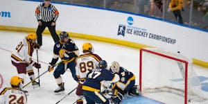 Forward Jimmy Snuggerud (81) scored on Canisius goaltender Jacob Barczewski, one of six third-period goals for the Gophers to break open their NCAA me