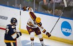 Minnesota Gophers forward Jimmy Snuggerud (81) celebrated after he scored an insurance goal in the third period.