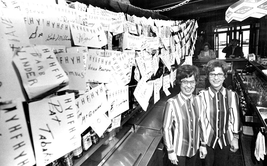 Twin sisters Jeanne Durant and Jeannette Abel stood behind the bar at Rogers Municipal Bar and Liquor store in 1977. The papers behind them were part of a fundraiser for the Minnesota Heart Fund.