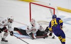 St. Cloud State goalie Jaxon Castor saved a shot from Minnesota State Mankato’s Lucas Sowder (21) in the first period of the Huskies’ 4-0 victory 
