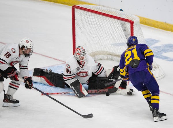 St. Cloud State goalie Jaxon Castor saved a shot from Minnesota State Mankato’s Lucas Sowder (21) in the first period of the Huskies’ 4-0 victory 