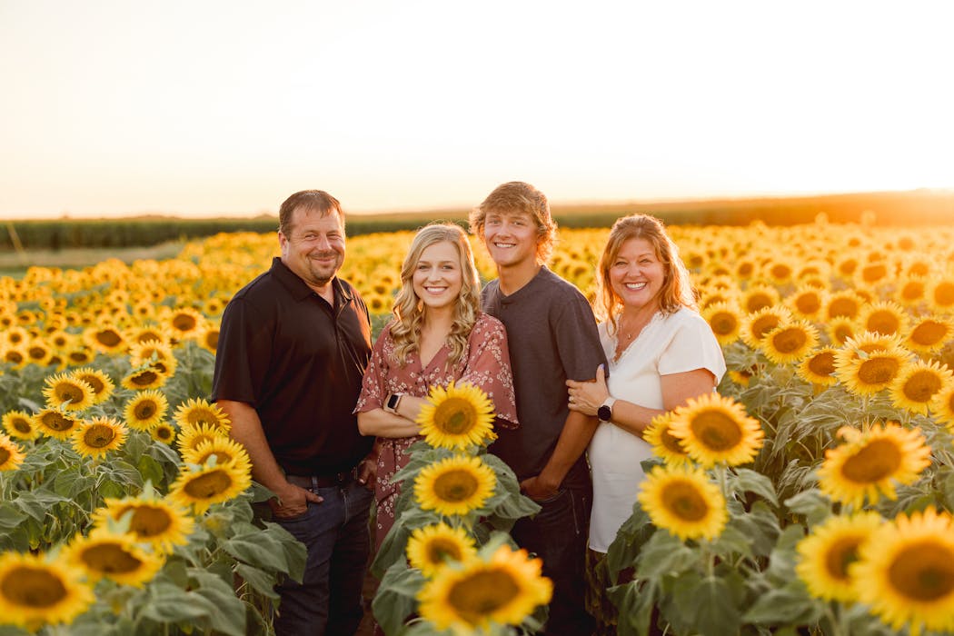 The Smudes: Tom, Katelyn, Mitchell and Jenni on their farm.