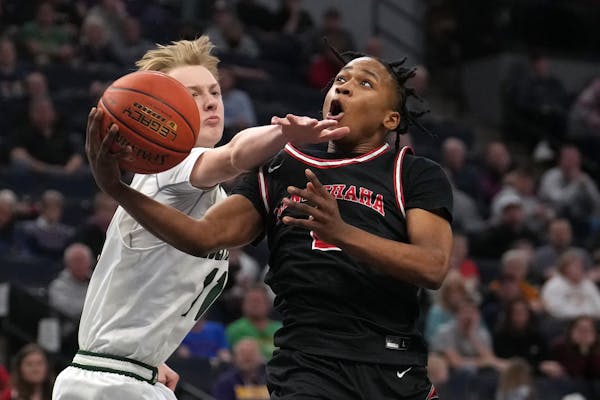 Minnehaha Academy guard Jerome Williams went up for a shot against Holy Family’s Paul Dorr in the second half. 