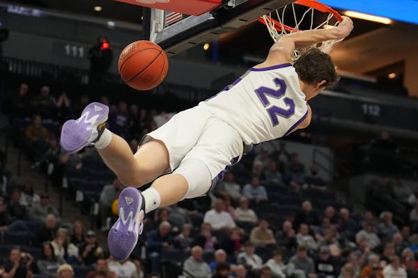 Albany guard Tysen Gerads (22) dunks the ball in the first half of his team’s semifinal game.