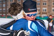 Benon Brattebo of Eden Prairie, the Metro Boys Nordic Skier of the Year, embraced Blaine’s Ben Lewis after Brattebo beat Lewis by a boot for the sta
