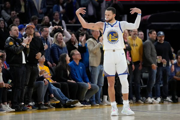 Warriors guard Stephen Curry got the fans pumped up during his team’s victory over the visiting 76ers on Friday night.