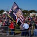 People gathered at Waco Regional Airport ahead of former President Donald Trump’s campaign rally, Saturday, March 25, 2023, in Waco, Texas. 