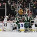 Wild right wing Ryan Reaves (75) celebrated with teammates after scoring a goal against the Chicago Blackhawks during the second period.