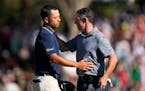 Rory McIlroy, right, is congratulated by Xander Schauffele after their quarterfinal round at the Dell Technologies Match Play Championship
