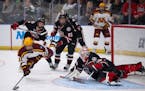 Gophers forward Mason Nevers  was dropped to the ice with a trip by St. Cloud State forward Grant Cruikshank in the first period Saturday night in Far