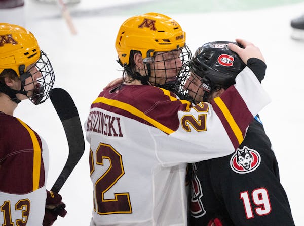 Gophers forward Bryce Brodzinski consoled his former teammate, St. Cloud State forward Grant Cruikshank, as the teams shook hands after Saturday night