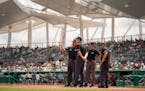The crew of umpires surveyed jetBlue Park in Fort Myers, Florida before the first pitch Thursday, March 17, 2022. The Minnesota Twins faced the Boston