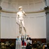 German Chancellor Angela Merkel, left, and Italian Prime Minister Matteo Renzi speak during a press conference in front of Michelangelo’s “David s
