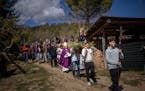 Local residents take part in a procession carrying a replica of the Our Lady of the Torrents, a virgin historically associated with drought, in l’Es