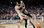 Miami guard Jordan Miller drove against Texas forward Timmy Allen in the second half of the Hurricanes’ 88-81 victory in the Midwest Regional final 