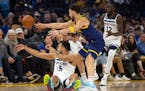Down but not out of the play, Wolves forward Kyle Anderson tried to pass away from Warriors guard Klay Thompson during the first quarter Sunday.