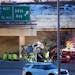 First responders attend to a crash scene on Highway 62 at 34th Ave. Monday, March 27, 2023 in Minneapolis.