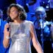 FILE - Singer Whitney Houston performs at the pre-Grammy gala & salute to industry icons with Clive Davis honoring David Geffen in Beverly Hills, Cali